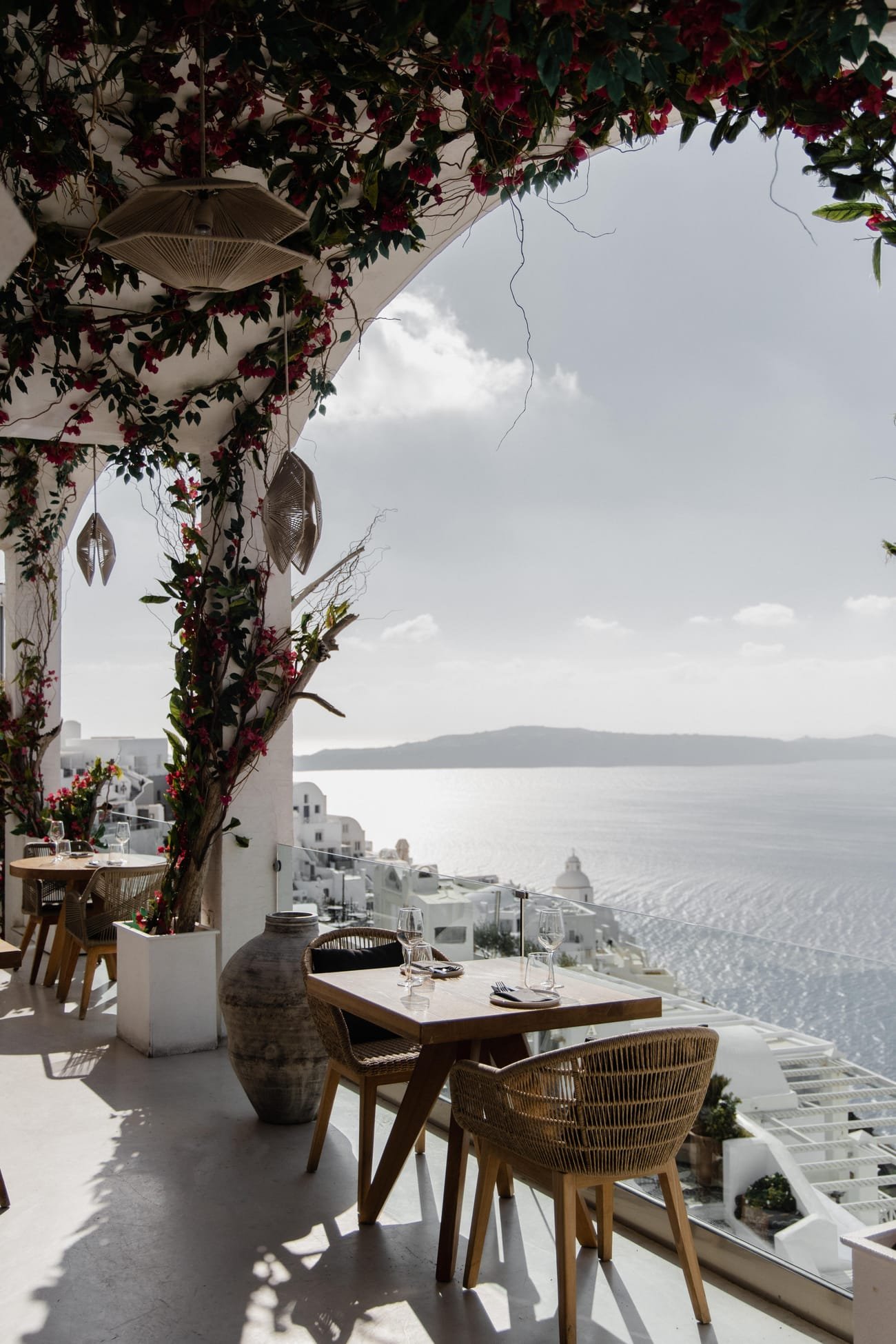 Kaliya Restaurant, Fira, Santorini — terrace table overlooking the caldera and the white houses of Fira