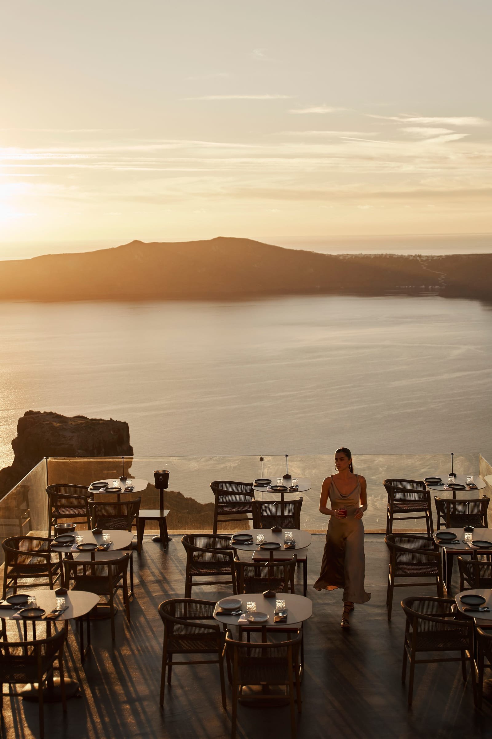 Mavro Restaurant, Imerovigli, Santorini — terrace set for dinner at sunset above the caldera