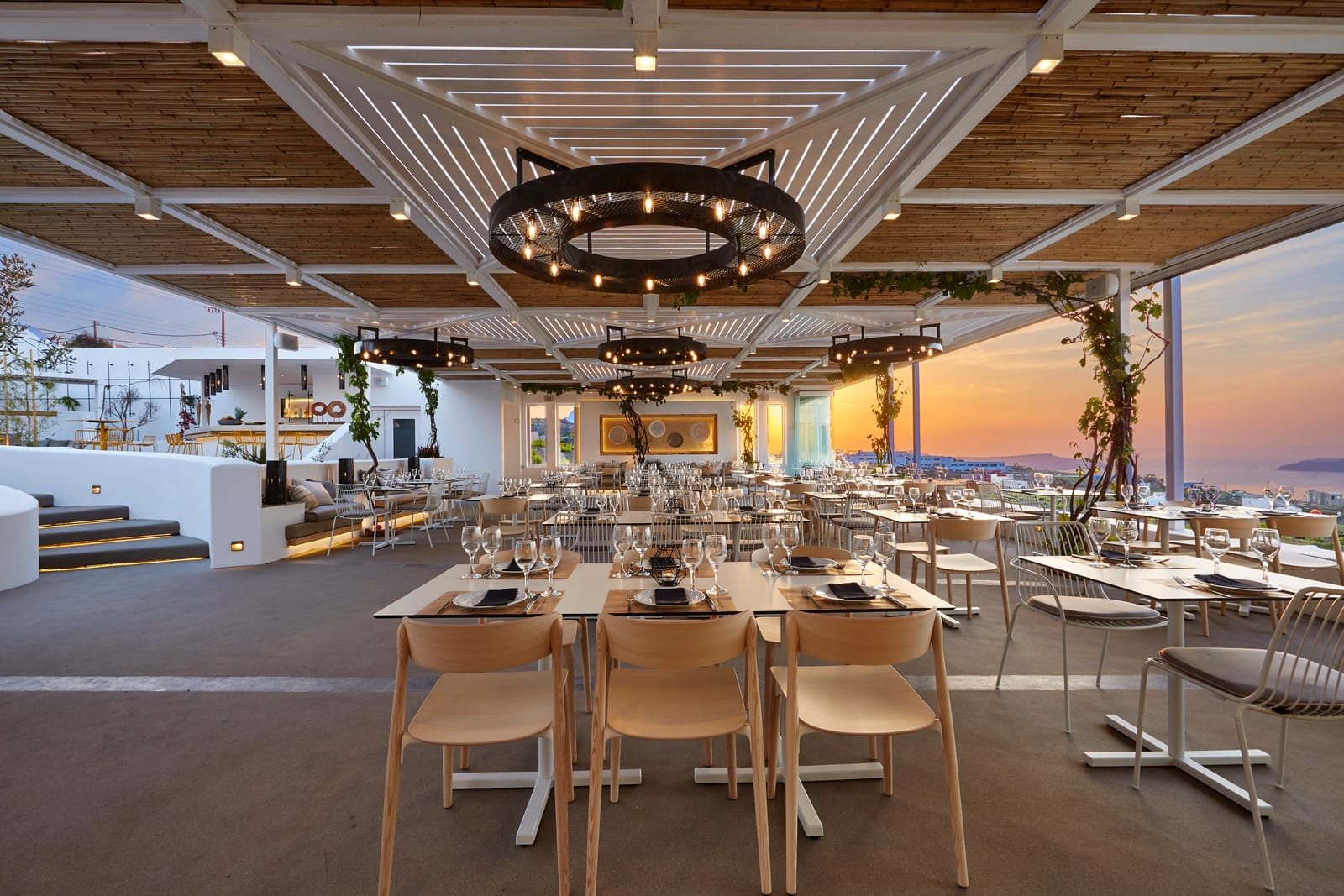 Pyrgos Restaurant, Pyrgos, Santorini — covered terrace set for dinner at sunset